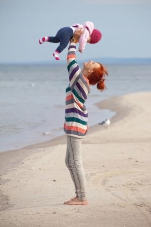 single mother with child on a beach