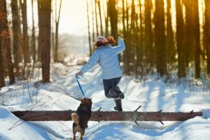 woman jogging with dog to relieve stress