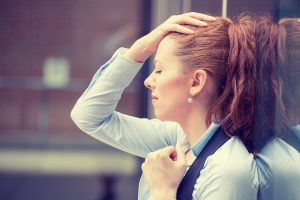 young professional woman experiencing stress over finances